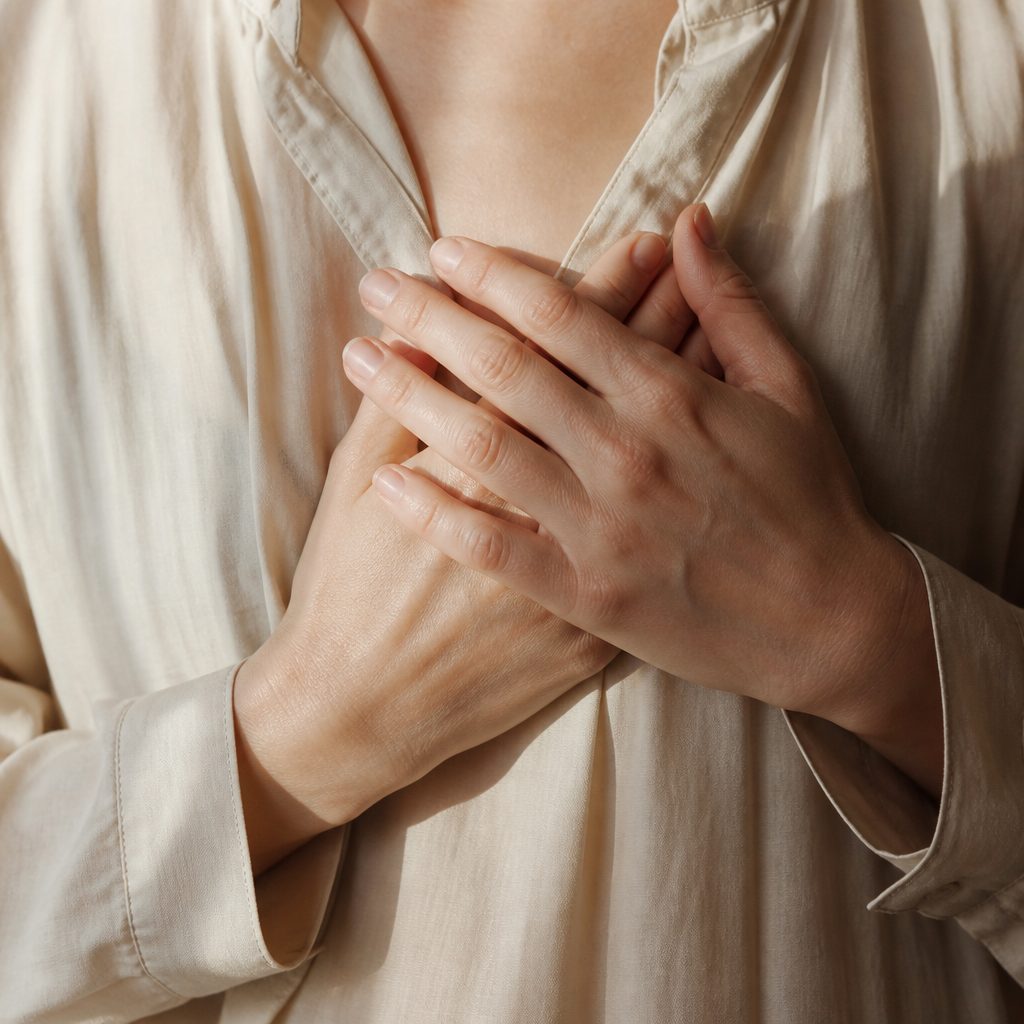 Hands resting, folded